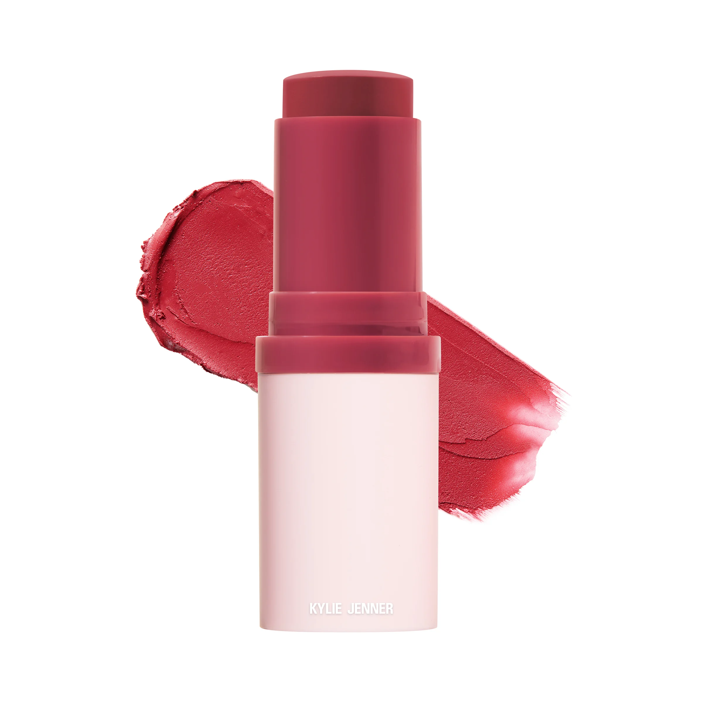 A red lip and cheek stick beside a swatch of its colour